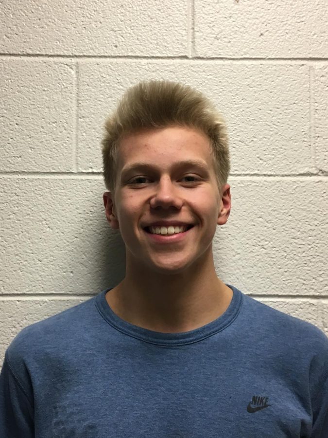 Griffin Watkins swims year-round and on the West team. He is one of the co-captains this season.