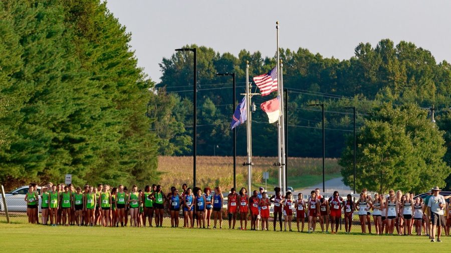 Distance runners line up at the start line at Ivey Redmon Park in Kernersville. The drives to and from meets take away valuable time from said runners. 