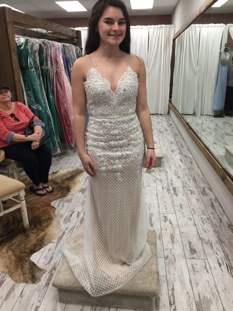 Senior Lauren Mason trying on prom dresses at Hip Chics. Hip Chics is a local favorite for many girls in Forsyth County.