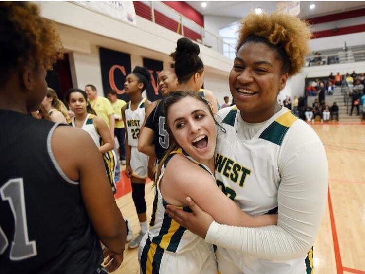 Seniors Callie Scheier and Destiny Griffin embrace after winning the 4A state quarterfinal game. The girls will take on the championship March 16 at NC States Reynolds Coliseum.