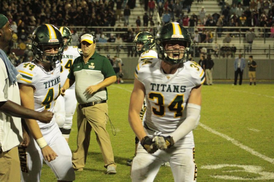 Football player celebrates a successful game. 