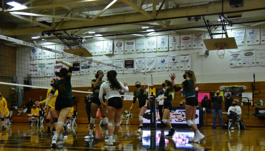 The team celebrates after a point. This year, to prevent further spread of the COVID-19 virus, players play in masks and there is a maximum fan occupancy of 25.