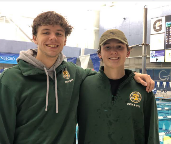 Teammates Logan McDonald and Alex Valliere at a West Forsyth swim meet. 