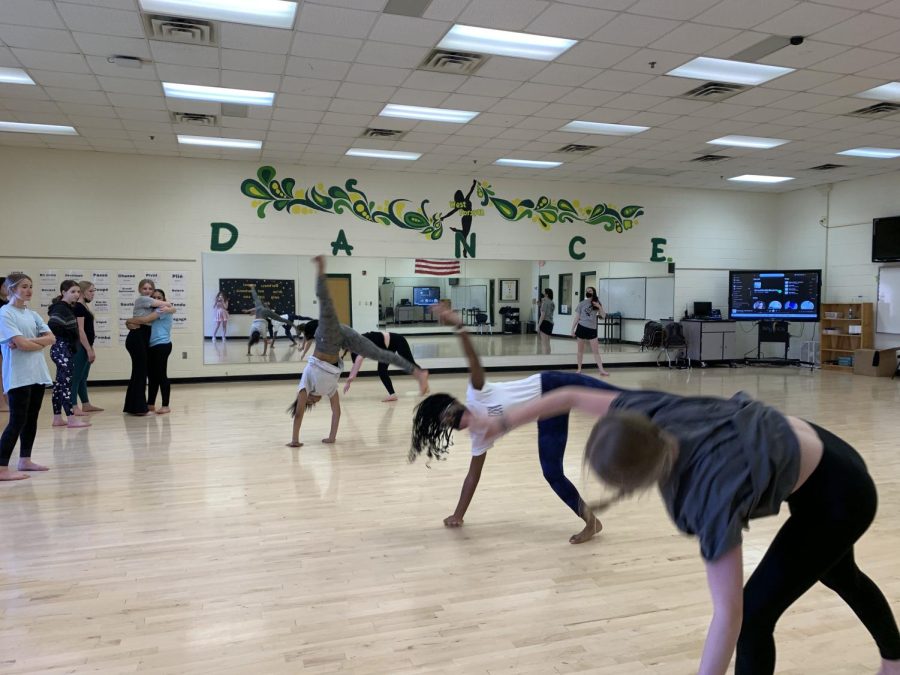 A dance class practicing for their recital.