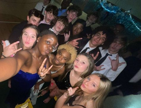 Freshmen and sophomores posing for a selfie at the dance