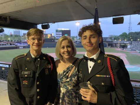 Carlos Lopez (right)) and Pierson Shaw (left) enjoy the 2022 military ball with Superintendent Tricia McManus (middle)