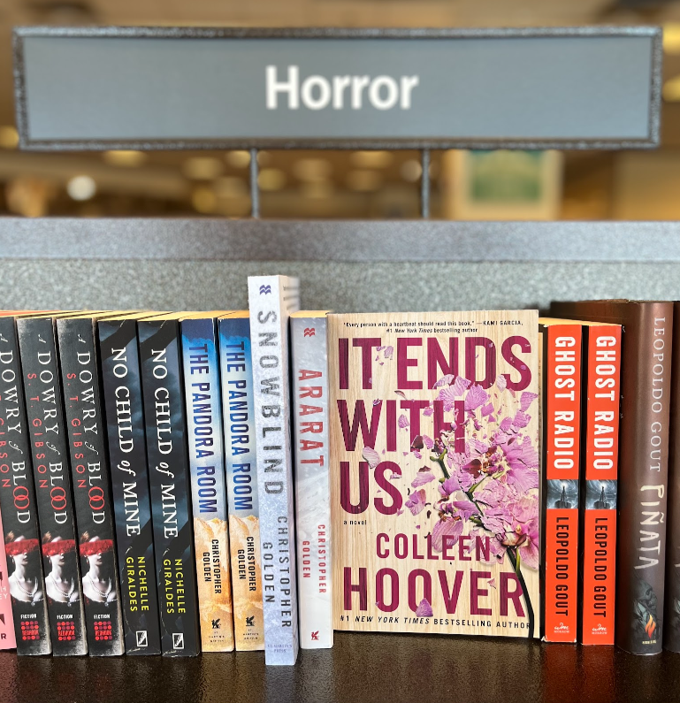 Colleen+Hoovers+novel+placed+in+the+horror+section+of+a+bookstore.+