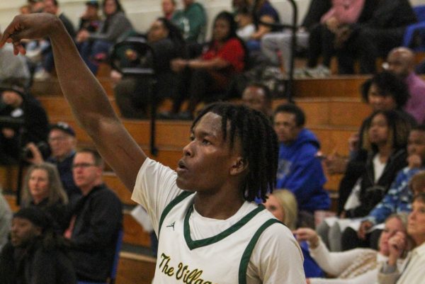 Junior Jacari Brim in a state playoff basketball game against Mooresville, a potential Titan conference opponent under the new classification system. (Photo courtesy of West Forsyth Sports Marketing)