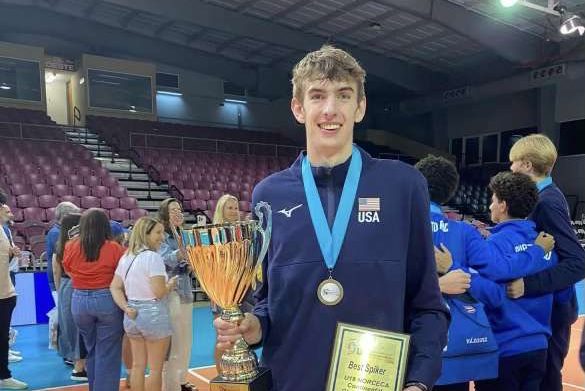 Lamoureux posing with his gold medal, championship trophy, and Best Spiker award following his succes with the U-19 Team USA squad in Puerto Rico.