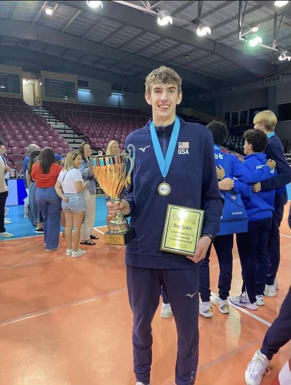 Lamoureux posing with his gold medal, championship trophy, and Best Spiker award following his succes with the U-19 Team USA squad in Puerto Rico.