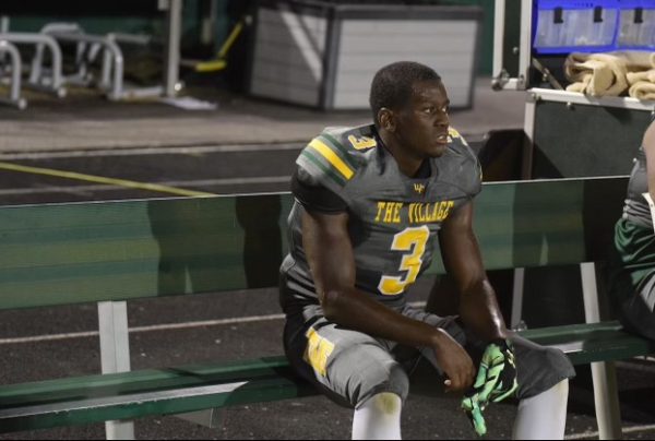 Chaplin taking a rest on the bench during the Homecoming game against Glenn this past season.