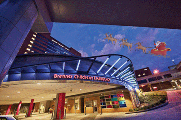 The Brenner’s Children’s Hospital with Santa flying over them.