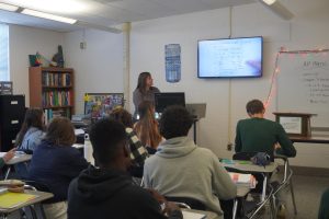 Students taking notes in their AP Pre-Calculus class