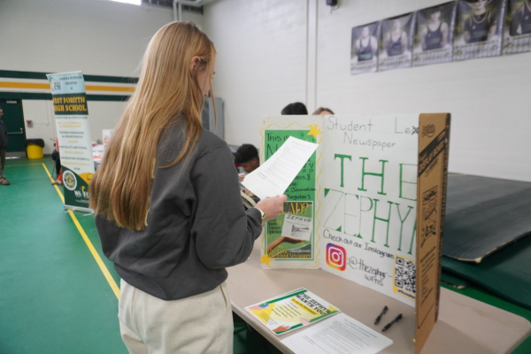 Student visits the Zephyr panel at the registration fair.