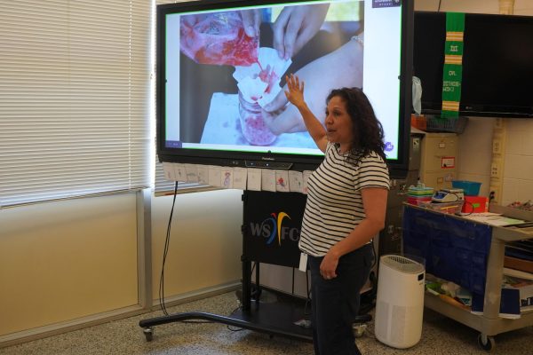 Dr. Ostasiewski teaching her biology class.