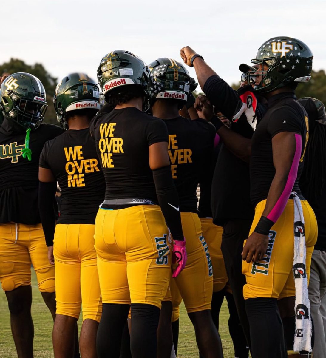 Football team huddles 